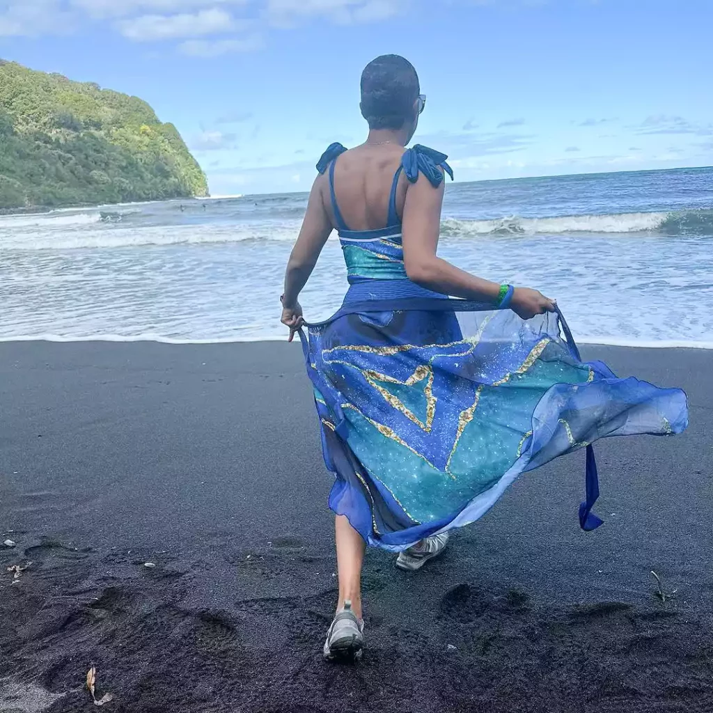 Tiffany Haddish is seen posing in front of a beach during a trip to Hawaii.