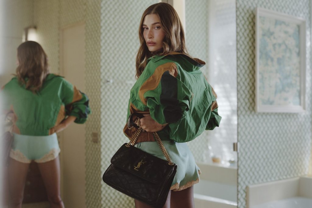 Saint Laurent’s “Tangerine Temptation” Campaign Stars Hailey Bieber in Neon Noir Fantasy Bieber